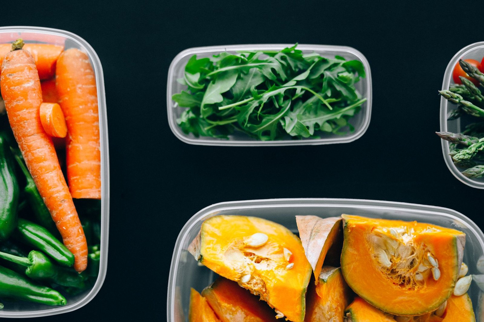 freezer meal plan — Healthy vegetables stored in plastic containers for fresh and nutritious meals.