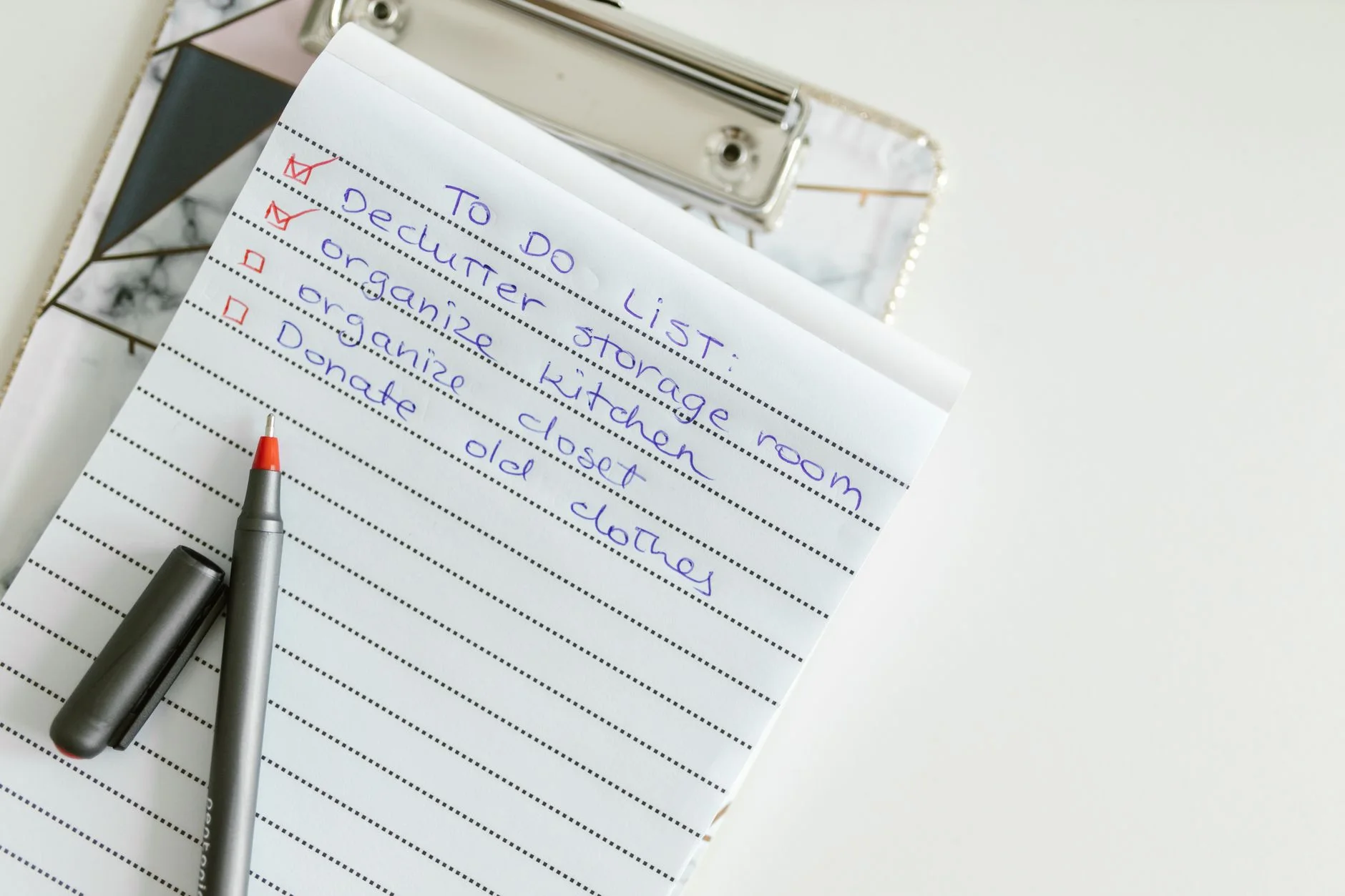 grocery list template — A neatly written to-do list on lined paper with a pen, perfect for organizing tasks.